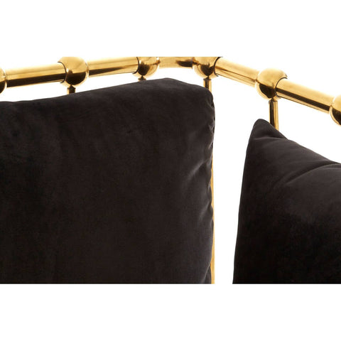 Black velvet upholstery with a sleek gold finish frame, showcasing a modern three-seater sofa design. The sofa features plush cushions and a stylish, curved backrest, highlighting its elegant aesthetic