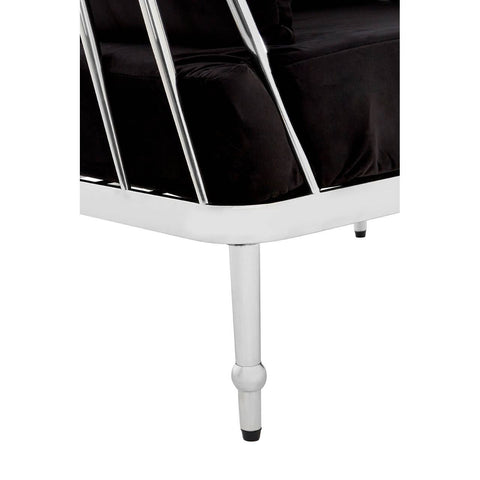 Black velvet upholstery with a sleek silver frame, showcasing a modern design. The sofa features a low back and clean lines, supported by slender legs. The overall aesthetic is elegant and contemporary, suitable for various interior styles