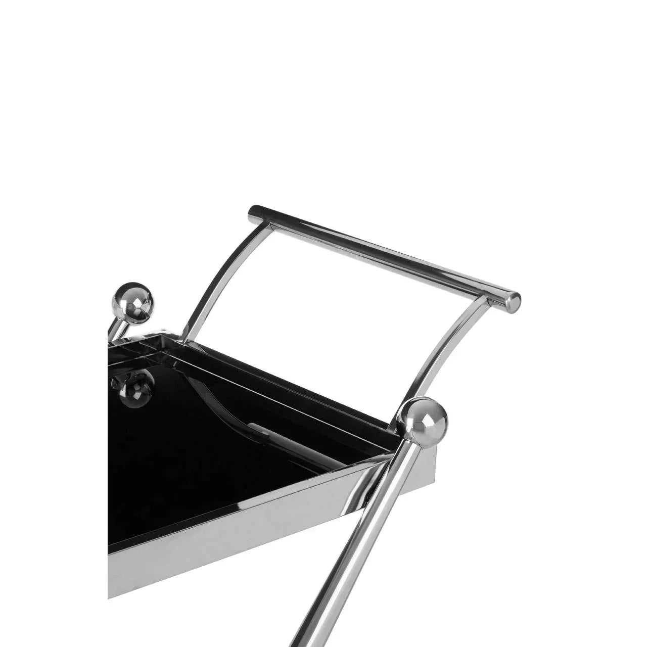 Chrome and black glass drinks trolley handle and top corner close-up
