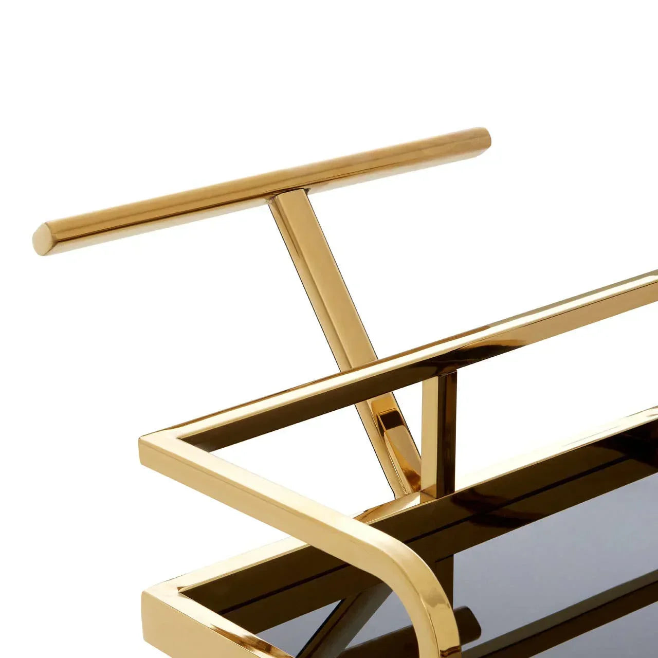 Gold metal bar cart handle and frame with black tempered glass shelf, close-up view
