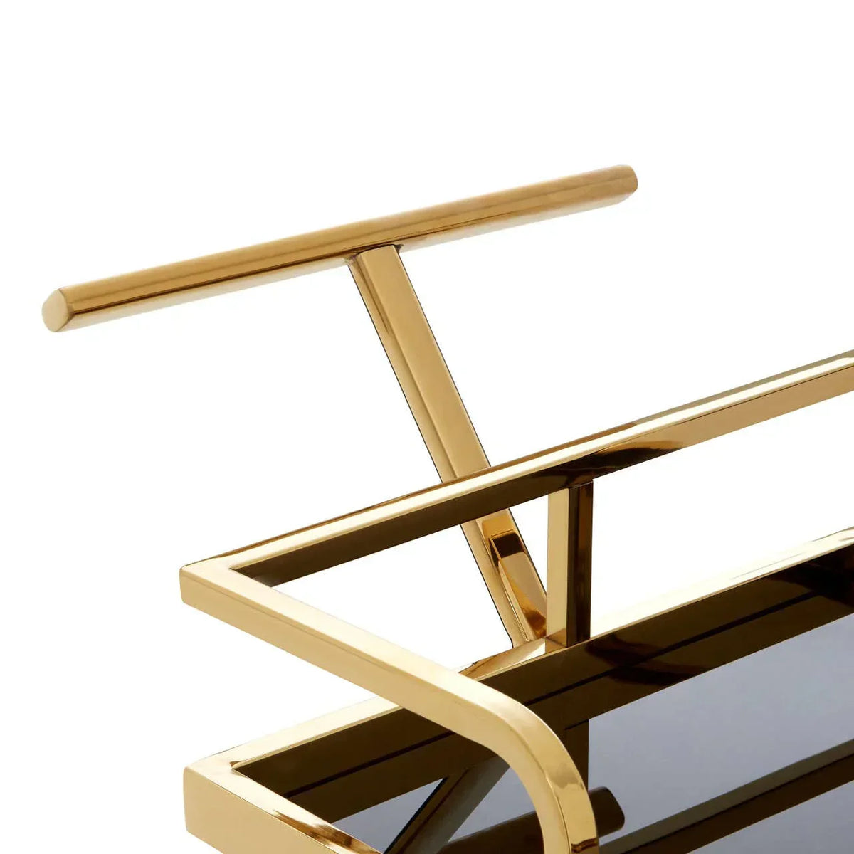 Gold metal bar cart handle and frame with black tempered glass shelf, close-up view