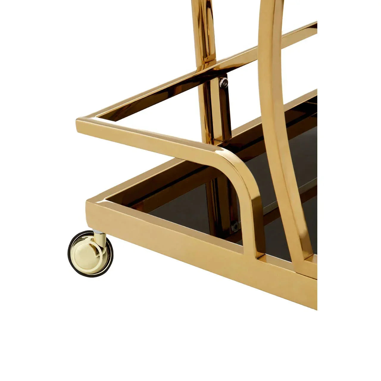 Gold metal bar cart frame with black glass shelf and caster wheel close-up