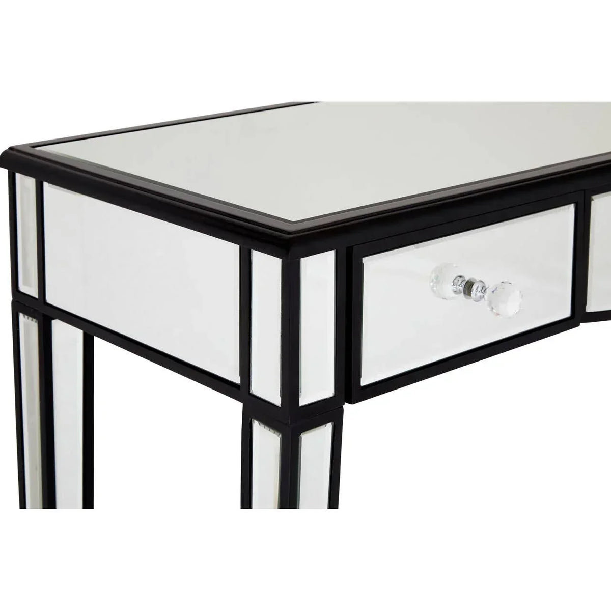 Mirrored dressing table with glass drawer knob and black trim, close view of corner detail