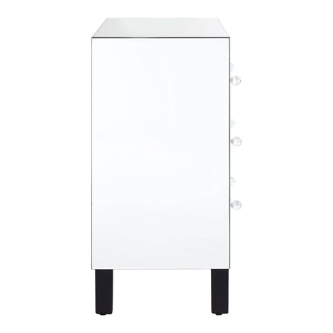 White chest of four drawers with a sleek design, featuring a smooth top surface and black legs. The drawers are adorned with simple handles, and the overall finish gives a modern and clean aesthetic