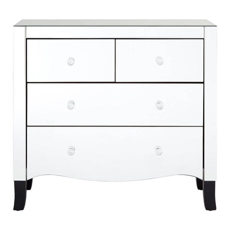 White chest of four drawers featuring a sleek design with a smooth surface, two smaller top drawers and two larger bottom drawers, all equipped with round silver handles. The chest is complemented by a mirror frame, and it stands on short, tapered black legs