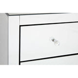 A close-up view of the Graciela Chest of 4 Drawers, featuring a sleek white finish with a subtle black outline around the drawers. Each drawer has a simple, elegant silver knob for easy access. The surface is smooth and reflective, enhancing the modern aesthetic of the furniture piece