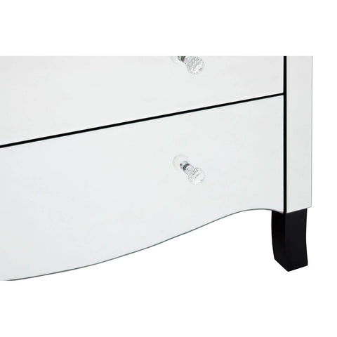 White chest of four drawers featuring a sleek design with a curved front and black feet. Each drawer has a clear crystal knob for easy opening. The surface is smooth and glossy, reflecting light