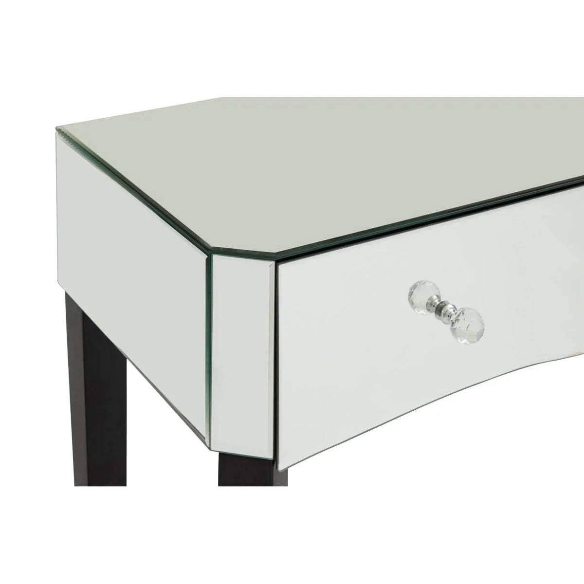 Mirrored corner dressing table with glass drawer knob and black legs, close-up view