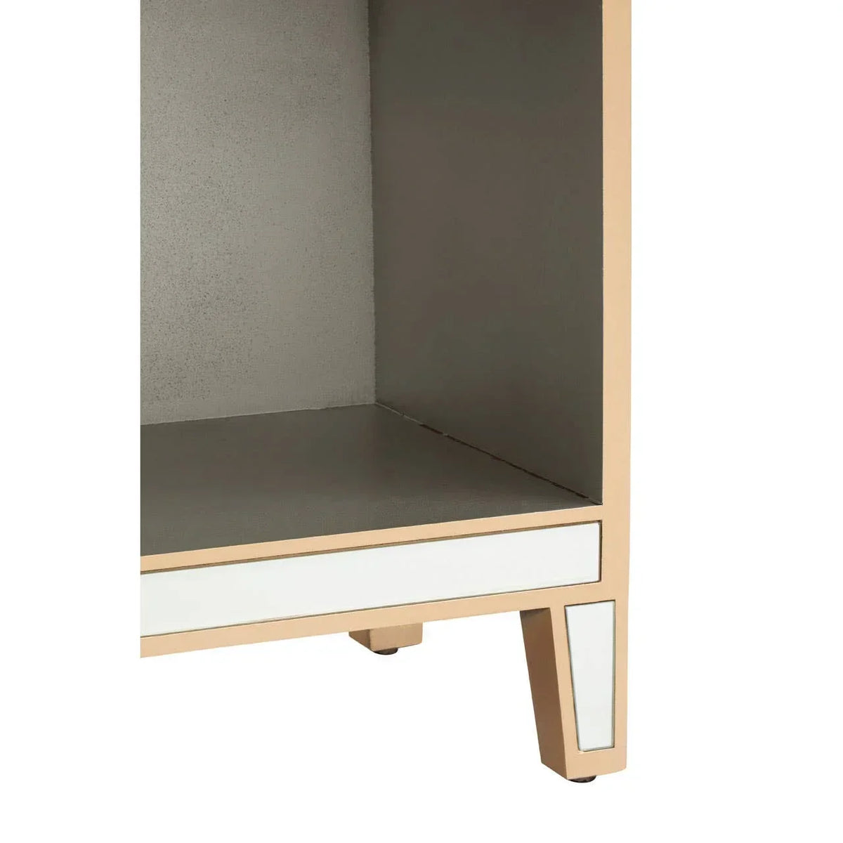 Mirrored bedside table corner with gold frame and open shelf detail