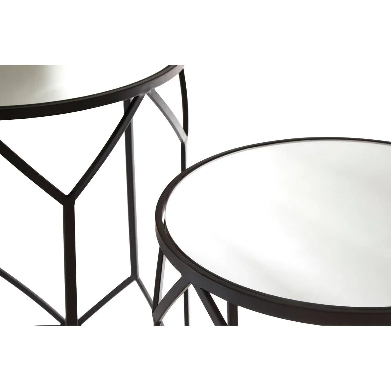 Round glass top side tables with black geometric metal frames, close-up view