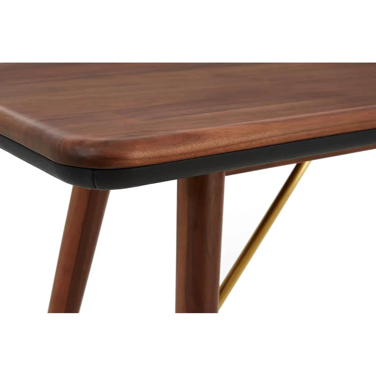 Close view of wooden dining table corner with rounded edge and gold support bar