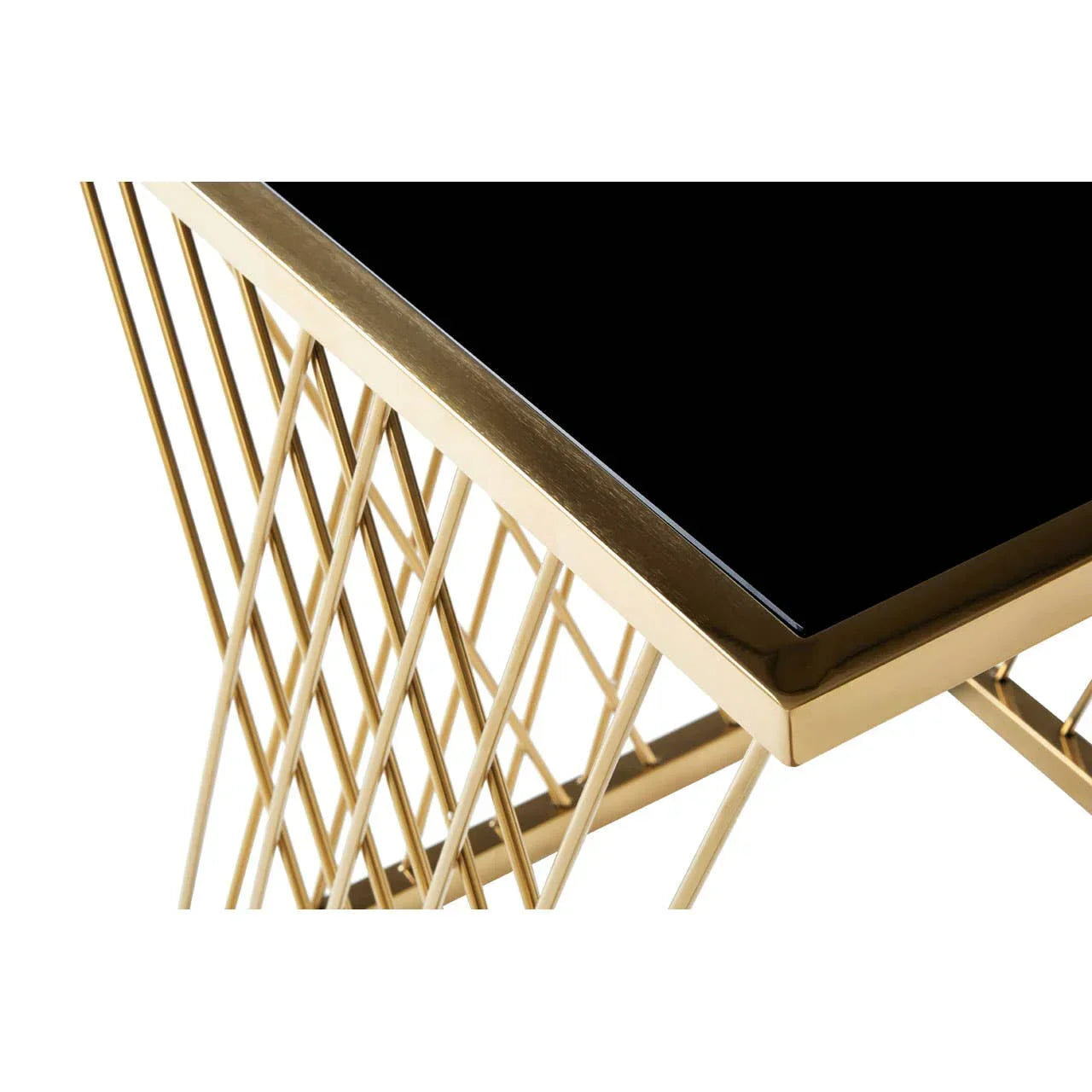 Black glass top coffee table with geometric gold metal frame, close-up corner view
