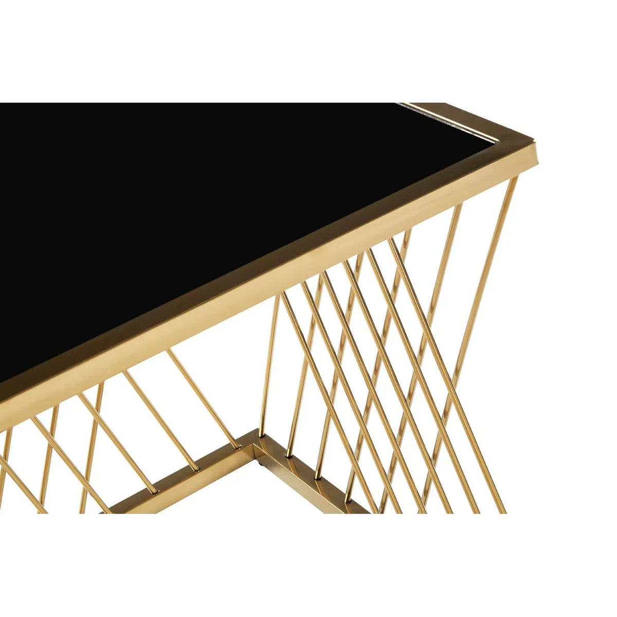 Close-up of gold metal console table with black glass top and geometric frame