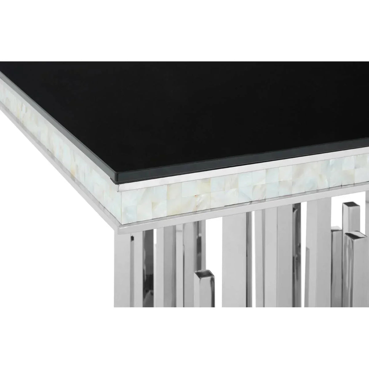 Black glass dining table corner with chrome legs and mother of pearl inlay detail