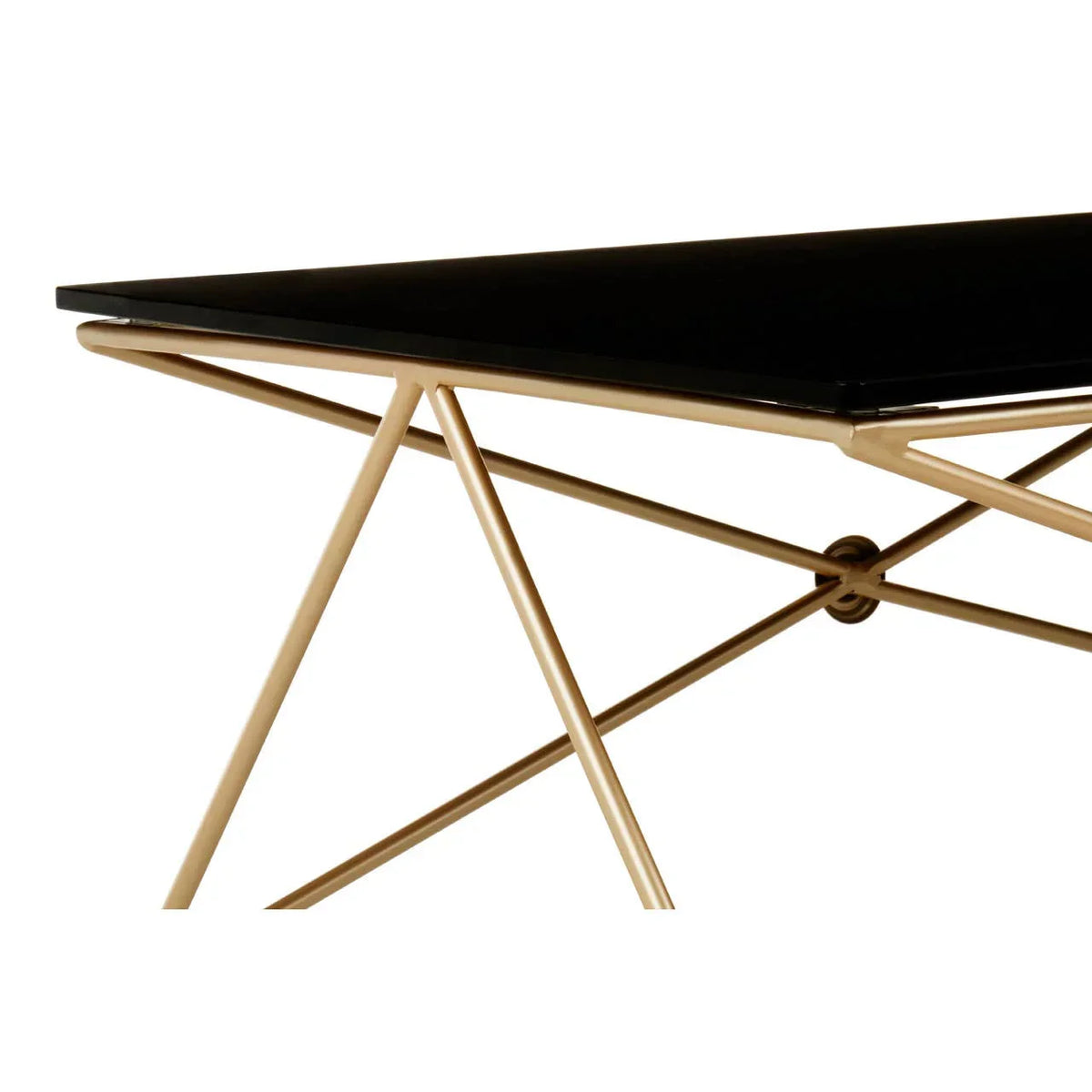Black glass dining table with gold metal geometric legs, modern corner view