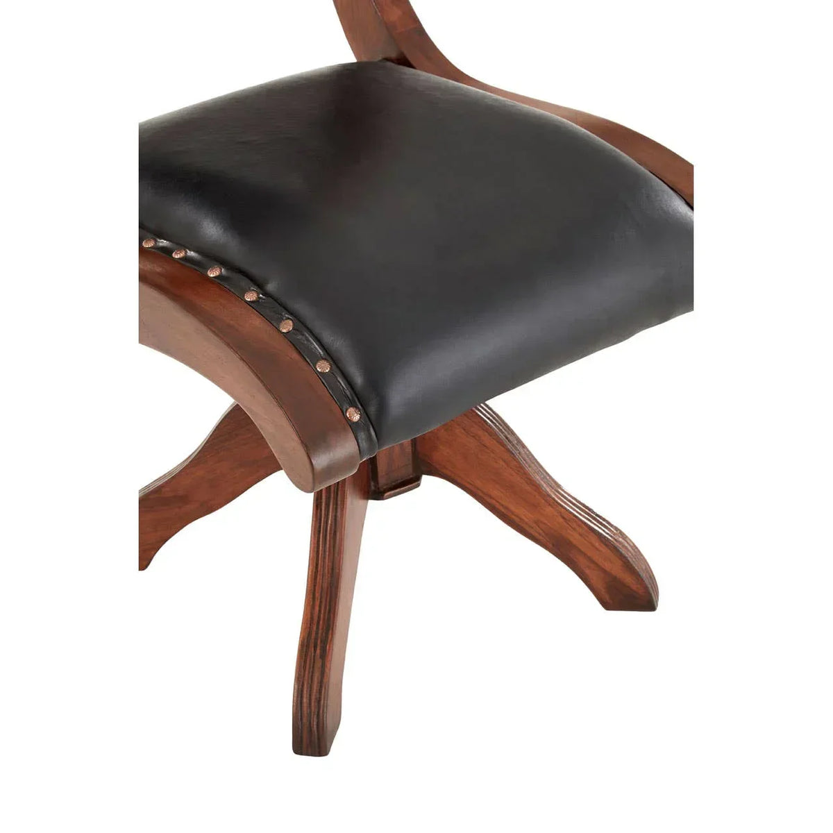Close up of dining chair with black leather seat, stud detailing, and wooden base
