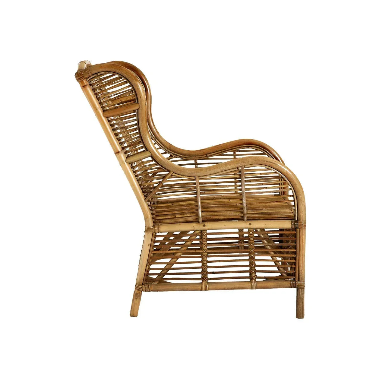 Natural rattan armchair with curved backrest and open weave design, side profile view