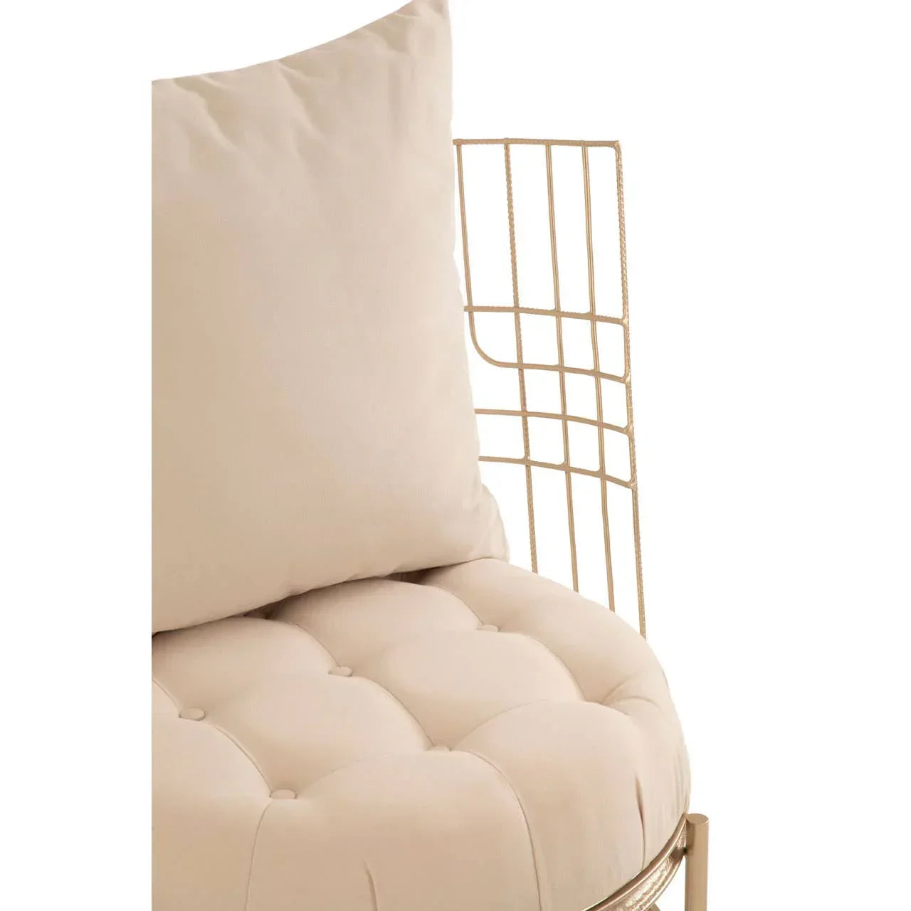 Beige cushioned chair with gold metal frame and button-tufted seat, close up view