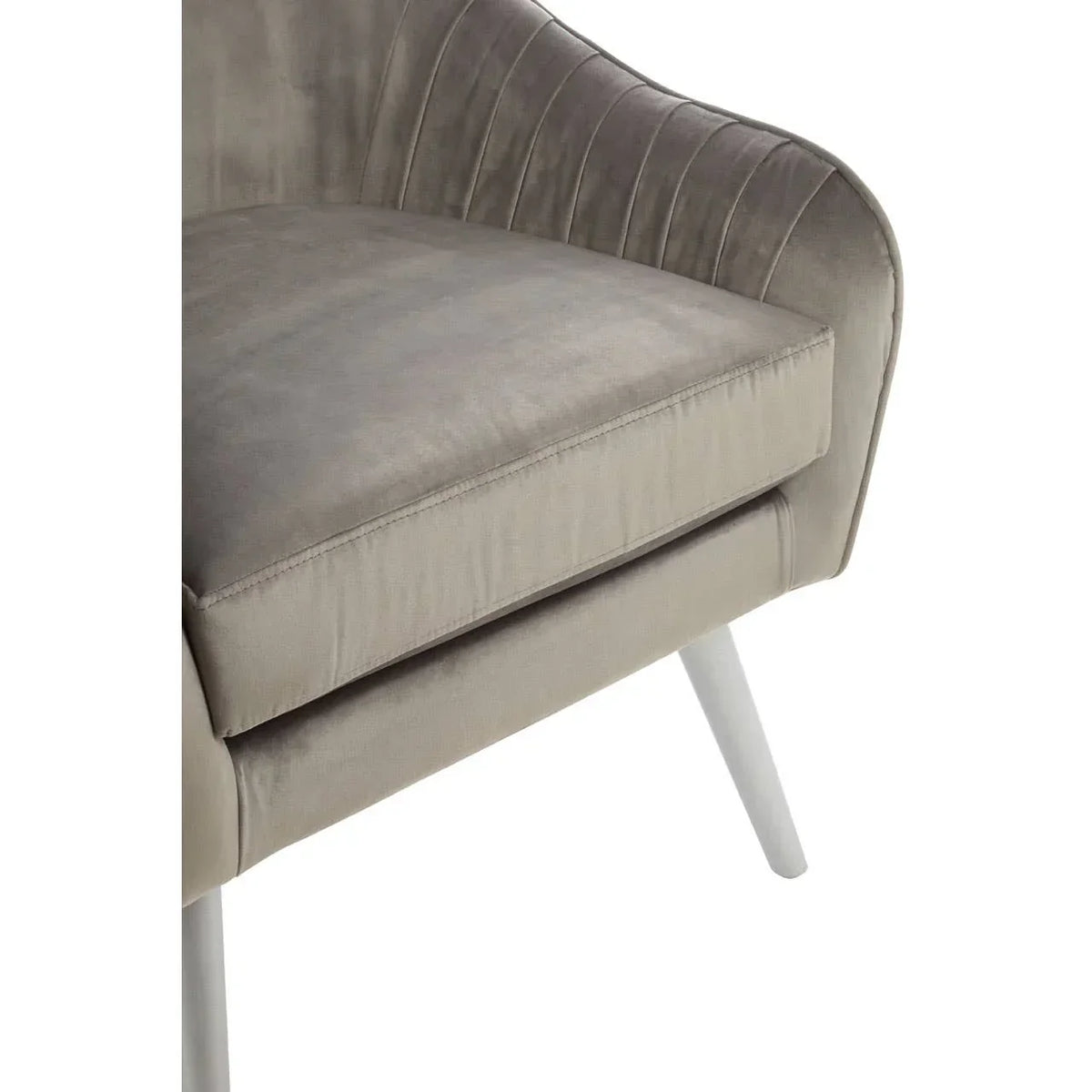 Close view of grey velvet armchair cushion and angled wooden legs