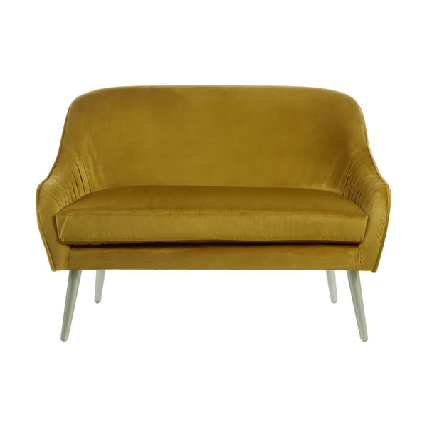 A mustard velvet two-seater sofa with a smooth, plush surface and rounded armrests, supported by sleek, metallic legs. The sofa features a minimalist design, showcasing a contemporary style suitable for various interior decor
