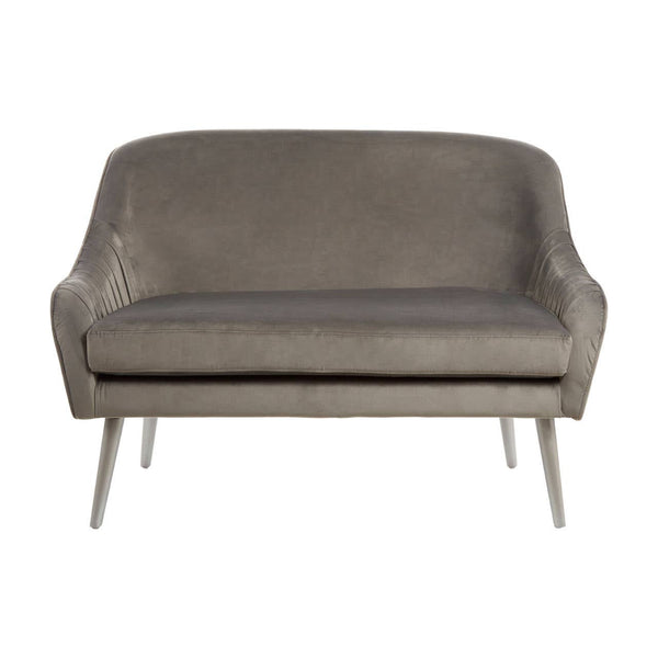 Grey velvet two-seater sofa with a curved backrest and sleek metal legs, featuring a minimalist design and soft upholstery