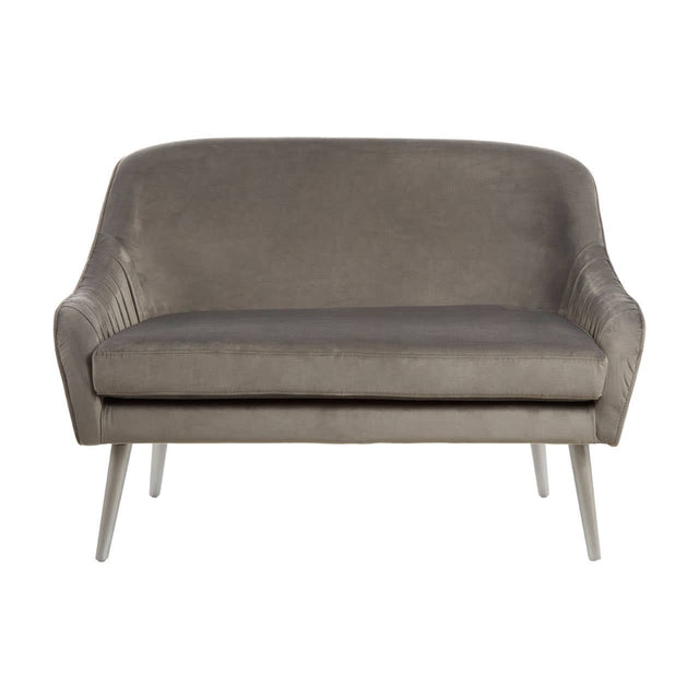 Grey velvet two-seater sofa with a curved backrest and sleek metal legs, featuring a minimalist design and soft upholstery