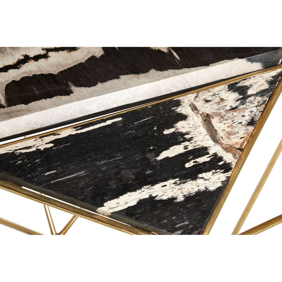Triangular coffee table with gold frame and black and white faux cowhide top detail