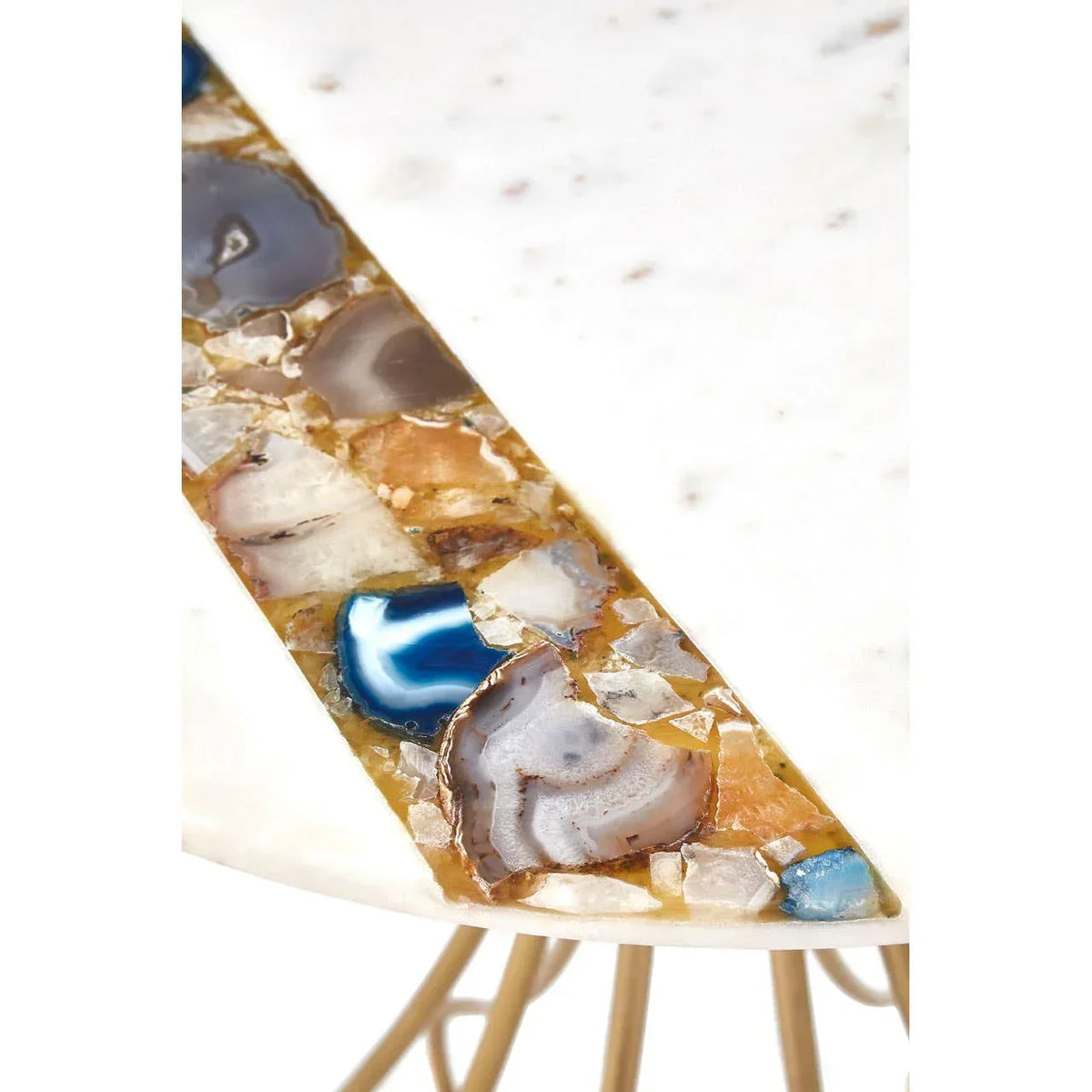 Round marble side table with mixed agate inlay detail and metal legs close-up