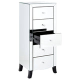 A sleek white chest of five drawers featuring a mirror frame, with one drawer partially open to reveal a black interior. The chest has a modern design with silver handles and elegant tapered black legs