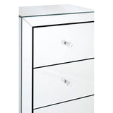 A sleek white chest of drawers featuring five spacious drawers, each with a crystal-like knob, and a reflective mirror frame accenting the top. The design is modern and minimalistic, showcasing clean lines and a glossy finish