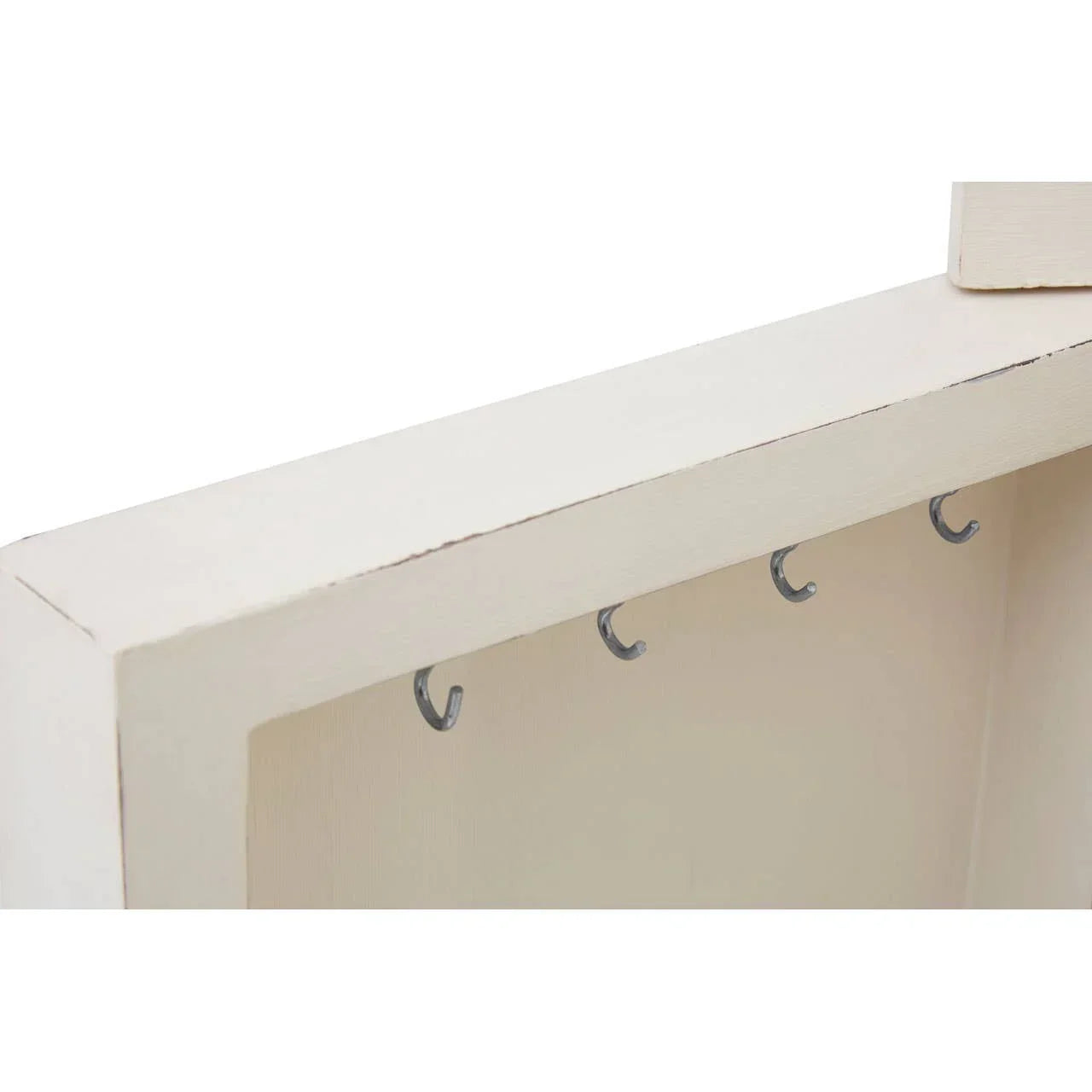 White wooden key rack with four metal hooks for hallway storage
