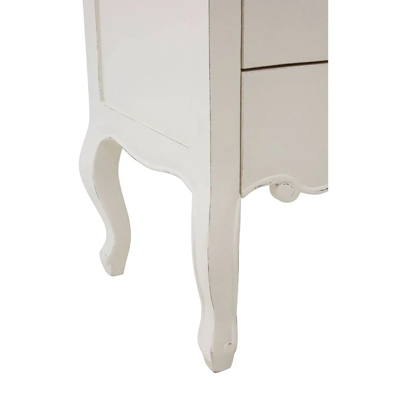 Close view of white wooden furniture leg with curved design and panel detail