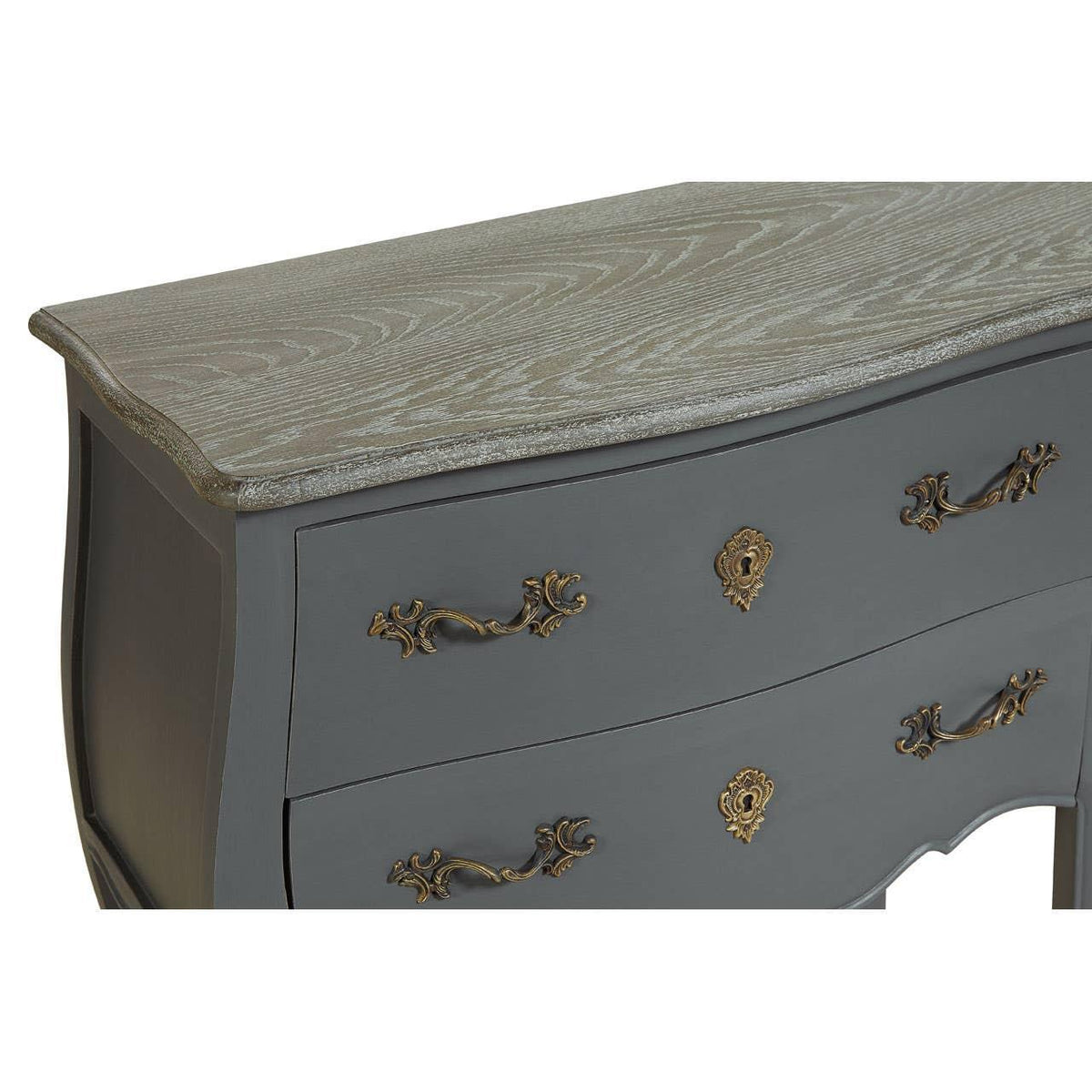 Grey wooden chest of drawers with ornate brass handles and textured wood grain top