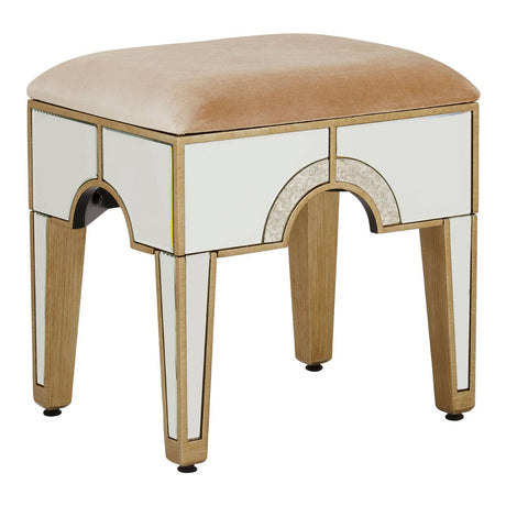 Champagne gold and mirrored stool with a soft, light beige upholstered top and elegant curved design, featuring four tapered legs and a reflective surface on the sides