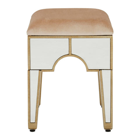Champagne gold and mirrored stool with a rectangular cushioned top in a light beige color, featuring a sleek design with gold trim and tapered legs. The front has an arch-shaped cutout, enhancing its elegant appearance