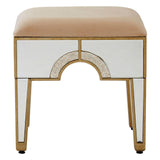 Champagne gold and mirrored stool with a soft, beige upholstered top and decorative gold trim, featuring a unique arch design on the front and sleek, tapered legs