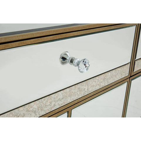 Champagne gold sideboard featuring a mirrored front with a textured panel and a sleek silver handle. The design showcases clean lines and a modern aesthetic, suitable for contemporary home decor