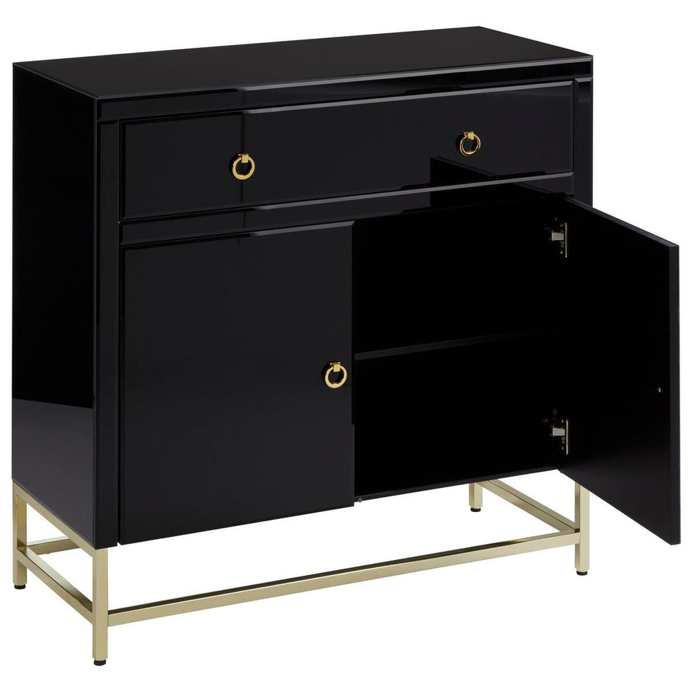 Black cabinet with a glossy finish featuring two drawers and two doors, showcasing a sleek design with gold hardware and a minimalist gold metal base. The cabinet is positioned at an angle, highlighting its modern aesthetic and functional storage space