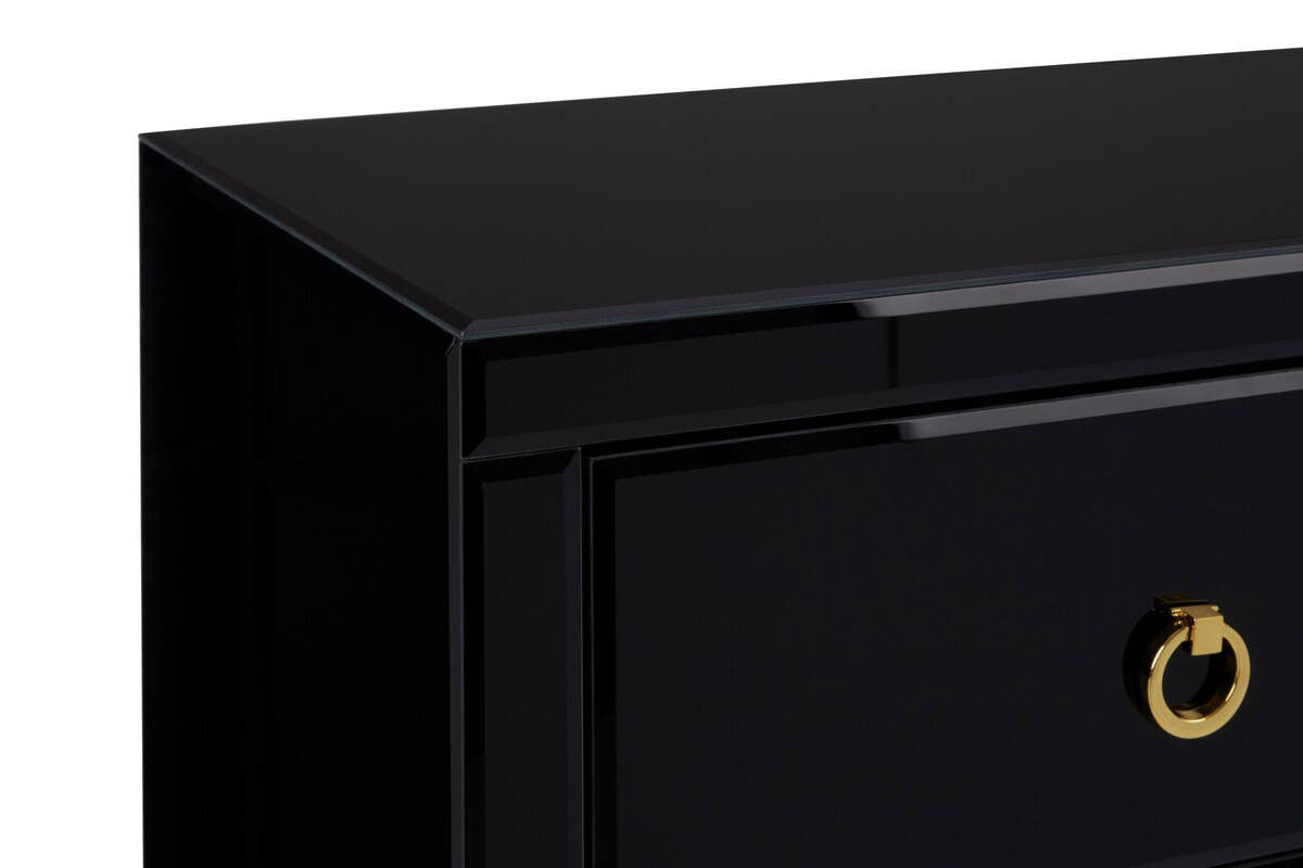 Black cabinet with a sleek, modern design featuring a smooth top surface and a single drawer with a circular gold handle. The cabinet has clean lines and a glossy finish, emphasizing its contemporary aesthetic