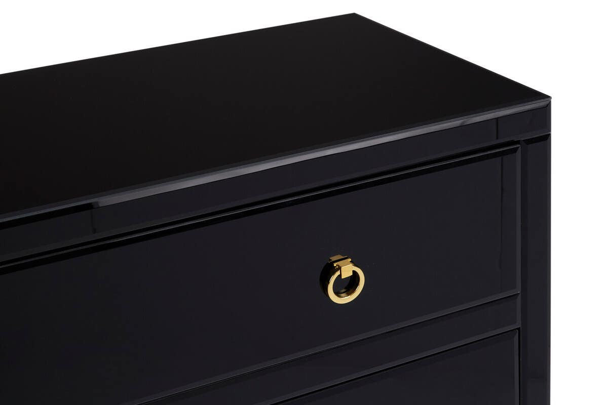 Close-up view of the Kensington Townhouse Black Cabinet featuring a sleek black finish and a gold circular drawer pull, highlighting the smooth surface and modern design
