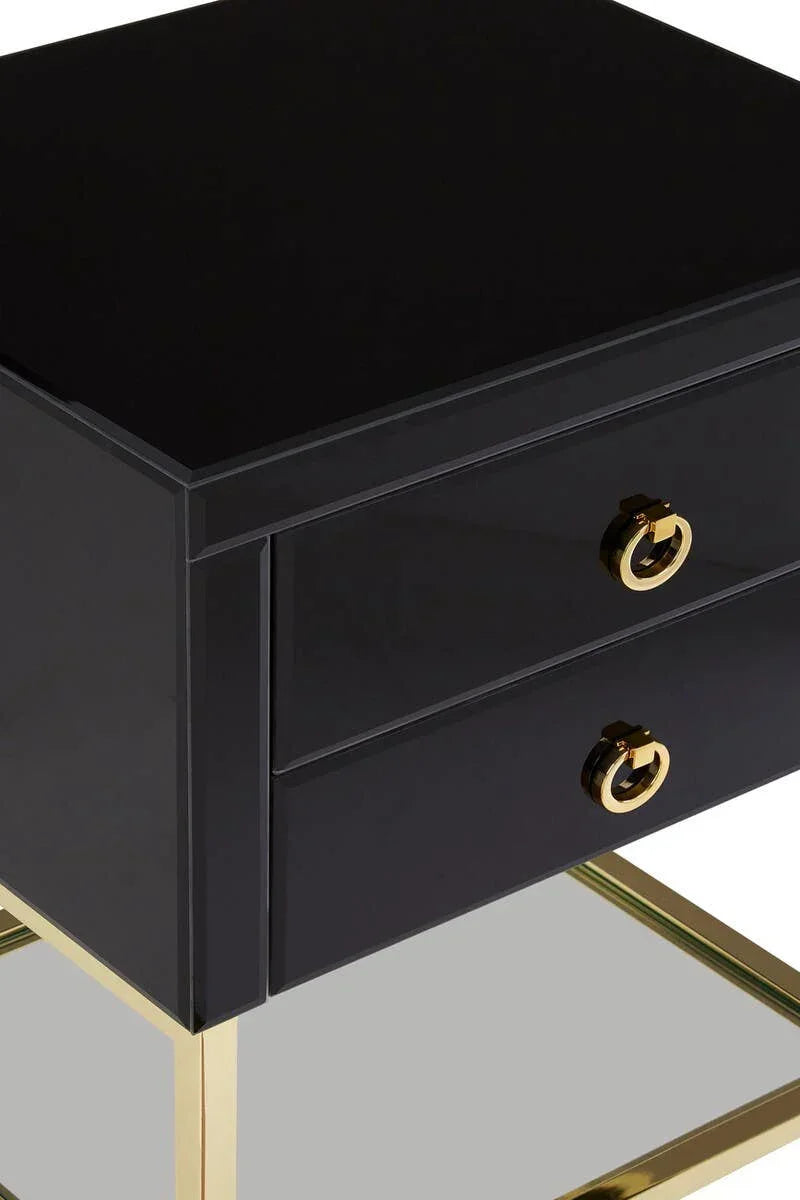 Black bedside table with gold handles and legs, mirrored bottom shelf, close side view