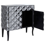 A stylish sideboard featuring a silver finish with a geometric diamond pattern on the front. It has two doors, one of which is open, revealing a spacious interior. The sideboard is supported by four slender black legs, adding a modern touch to the design