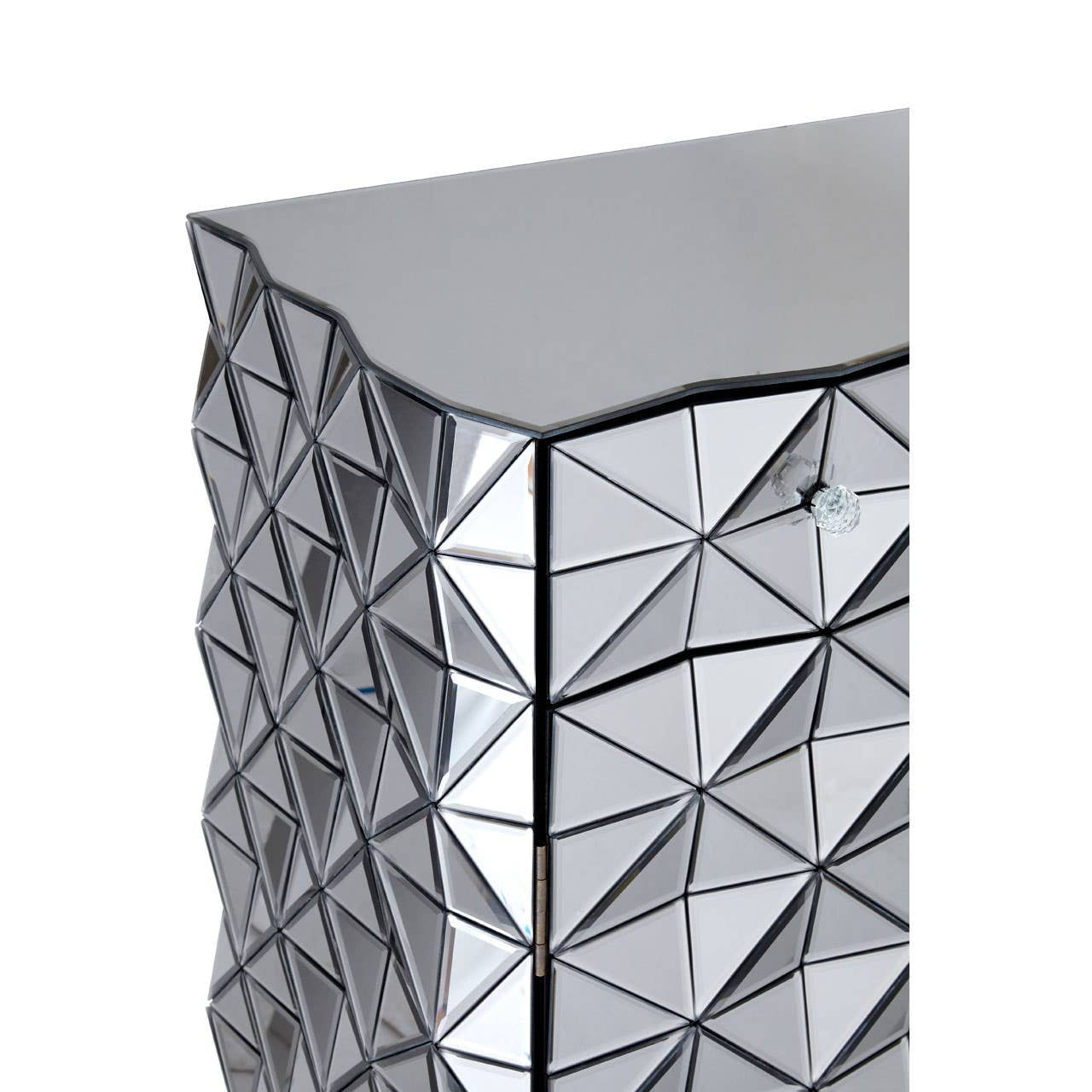 Silver finish sideboard with a geometric, textured surface featuring triangular patterns, showcasing a modern and sleek design. The top edge is smooth and straight, complementing the reflective quality of the material