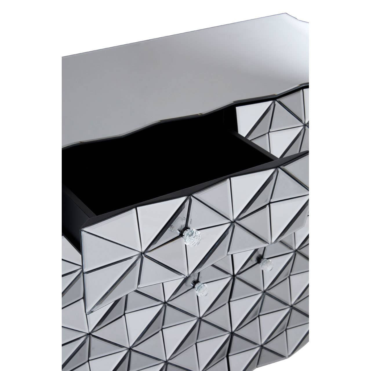 A close-up view of the Soho 2 Door Sideboard featuring a sleek silver finish with a geometric pattern of triangular facets. The sideboard has two doors, one partially open, revealing a dark interior space. The reflective surface adds a modern touch to the design