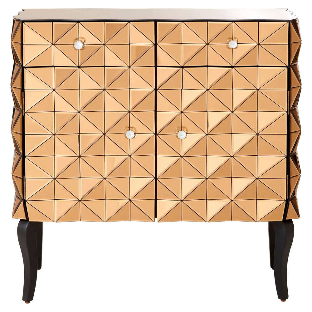 A stylish cabinet featuring a geometric pattern on the front, with a warm copper finish and two doors. The cabinet has four small, round knobs and stands on four slender black legs, adding a modern touch to its design