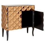 Soho 2 Door Copper Finish Cabinet featuring a geometric pattern on the front, two doors with a sleek black interior, and elegant black legs. One door is open, revealing the storage space inside. The cabinet has a warm copper finish that adds a modern touch to home decor