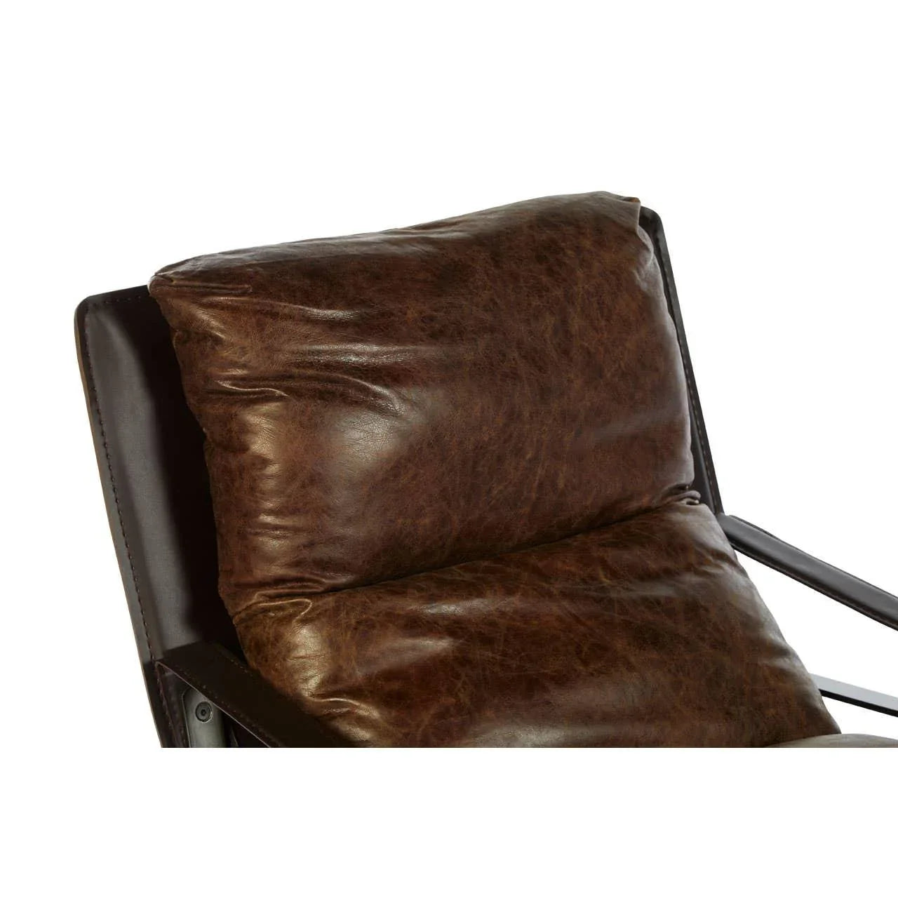 Close up of brown leather armchair cushion with visible stitching and black frame