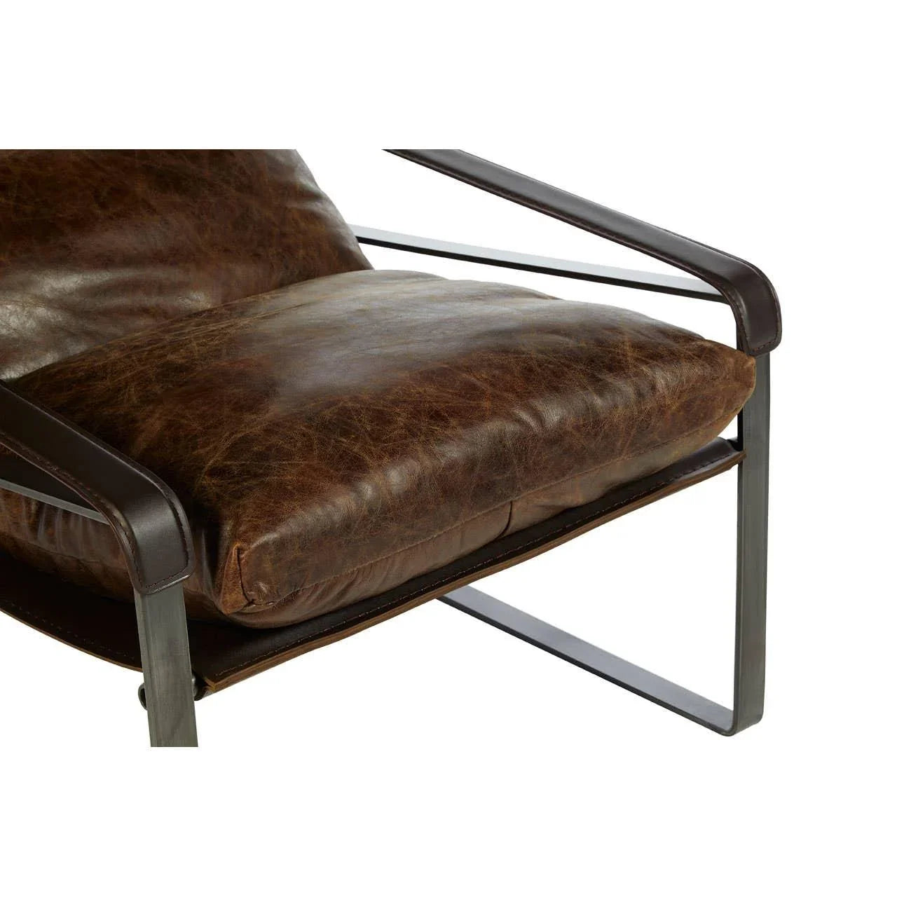 Brown leather armchair seat with metal frame and angled armrest detail