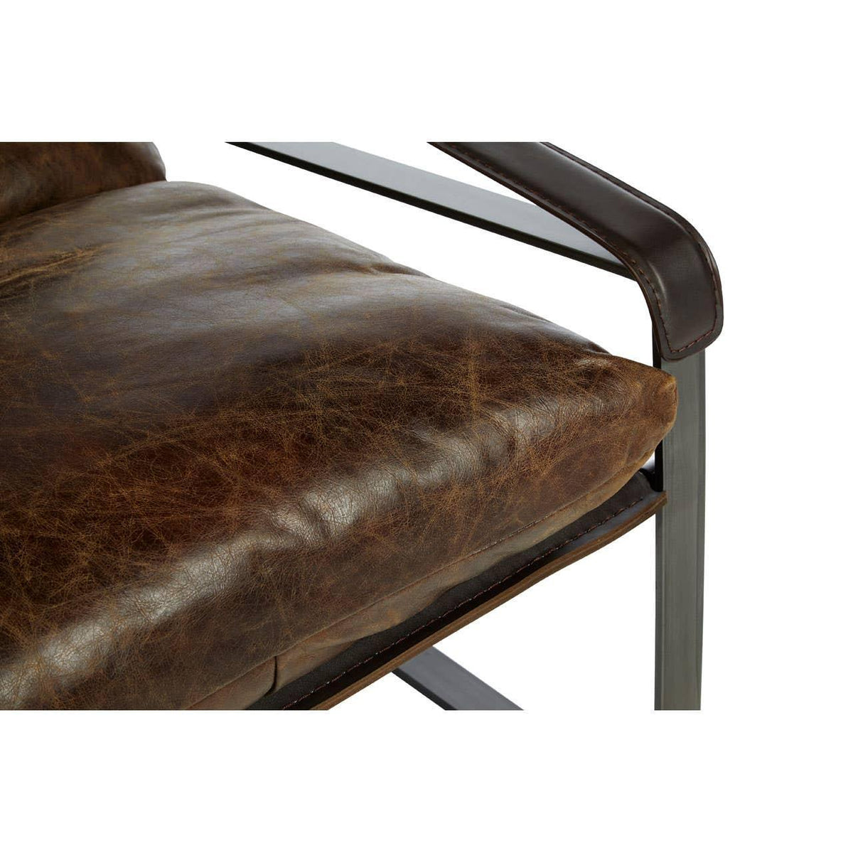 Brown leather cushion and metal arm detail on modern accent chair