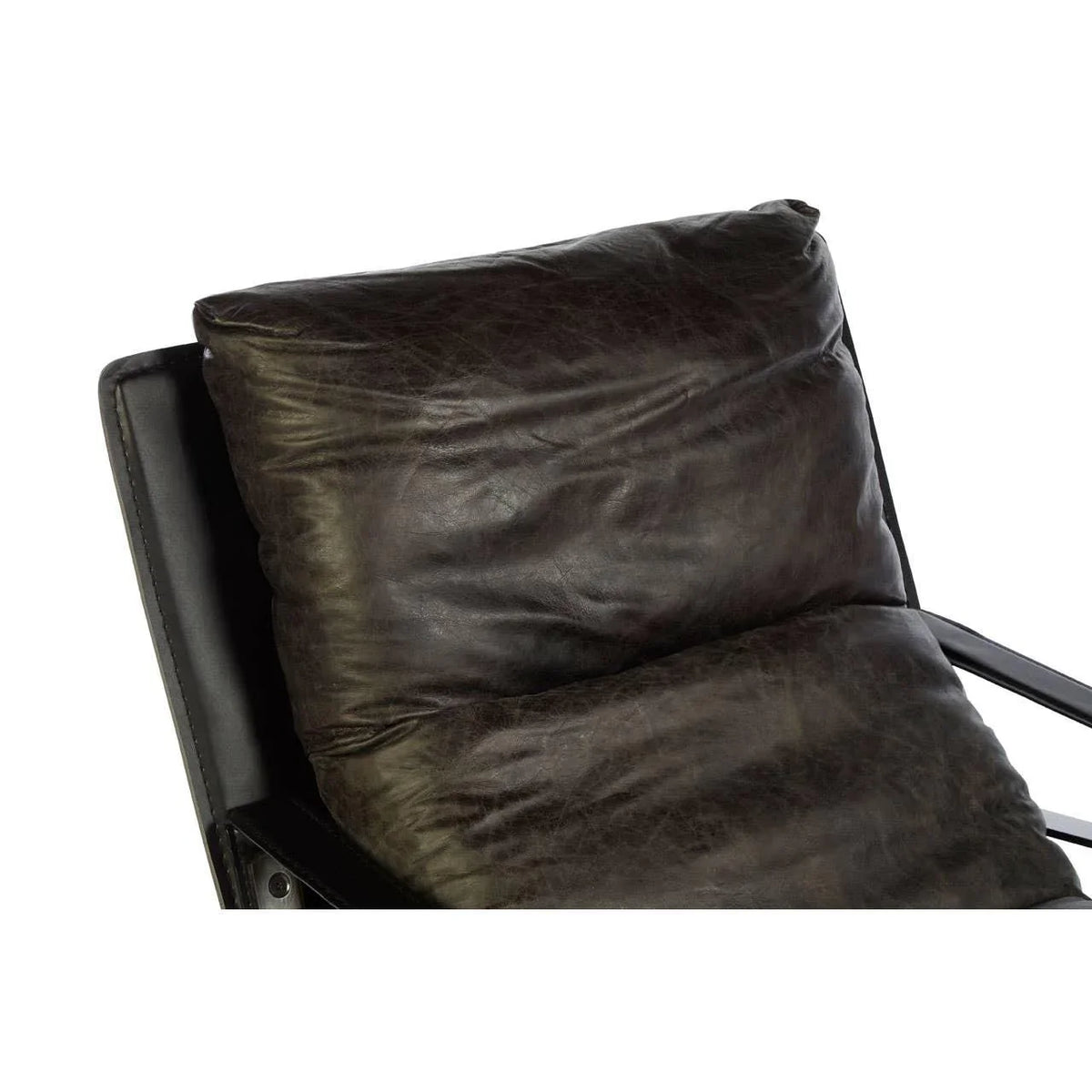 Closeup of dark leather armchair backrest cushion and arm detail